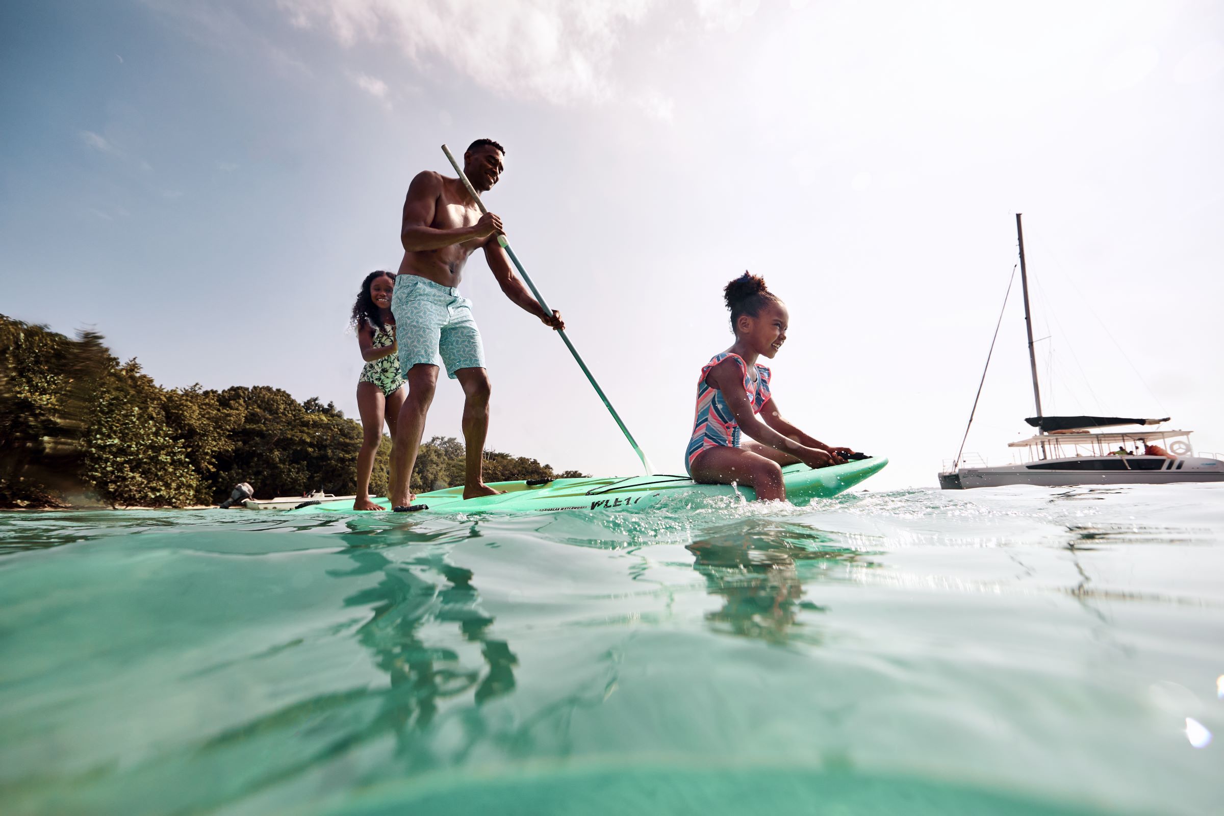 Family on stand-up paddle boards